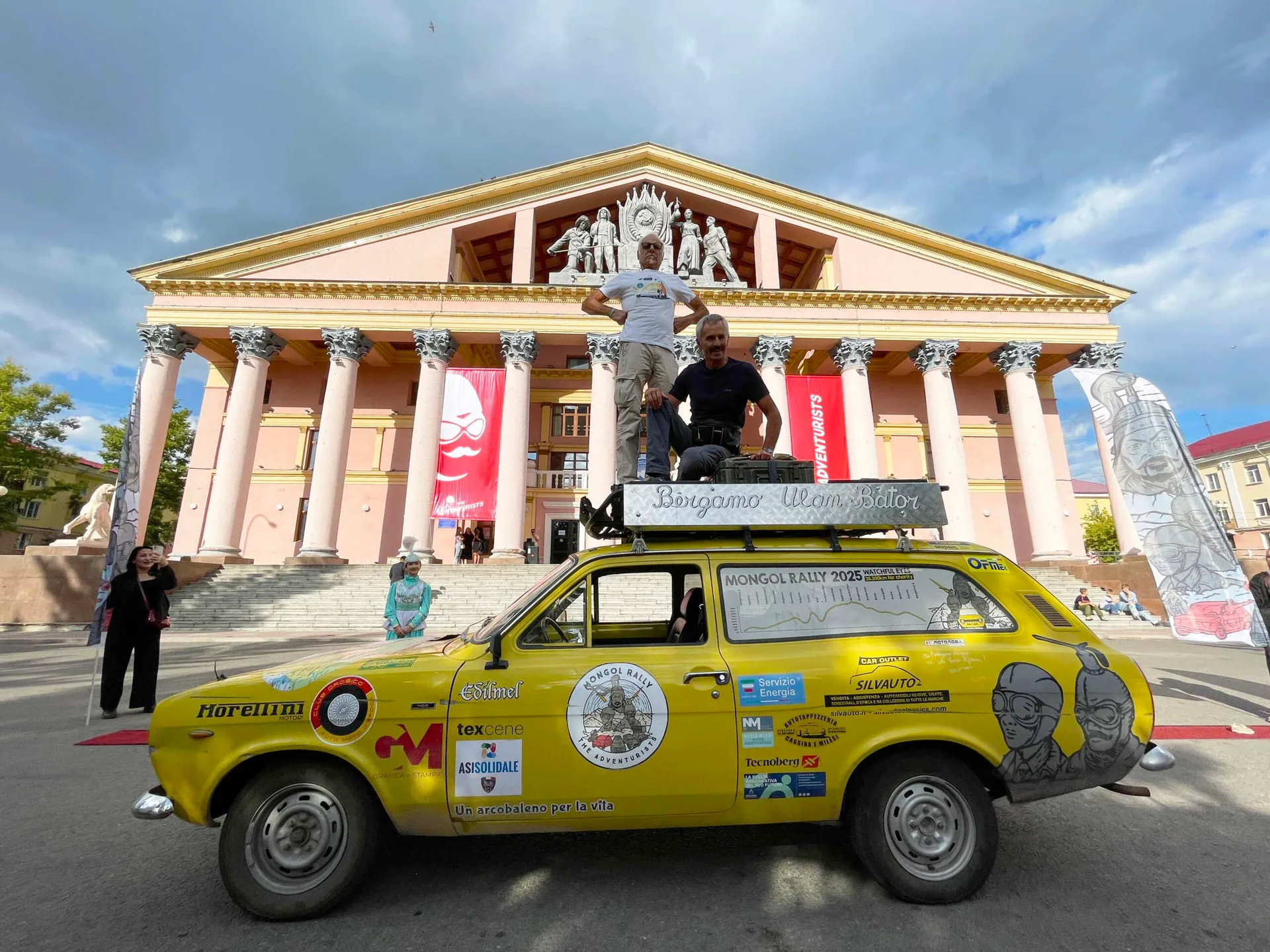 Team Watchful Eyes and their 1972 Ford Escort at the Finish Line.