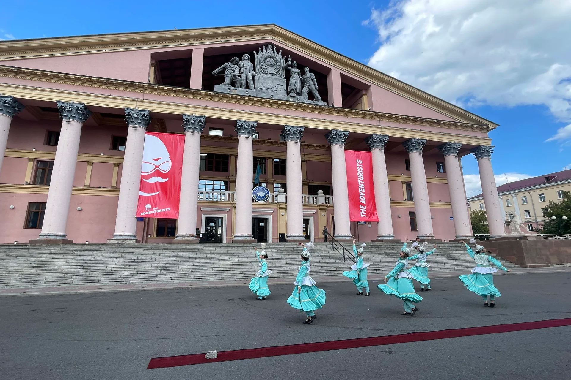Traditional Kazakh dancers in front of the Palace of Culture of Mettallurgy.