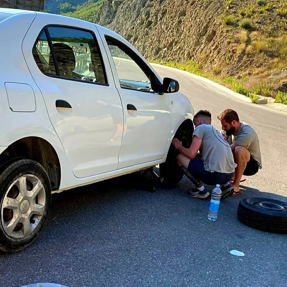 Albania: Donating their spare tyre to a German couple stranded on a mountain pass with no spare.